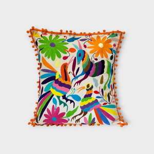 Otomi pillow cover with orange pompoms