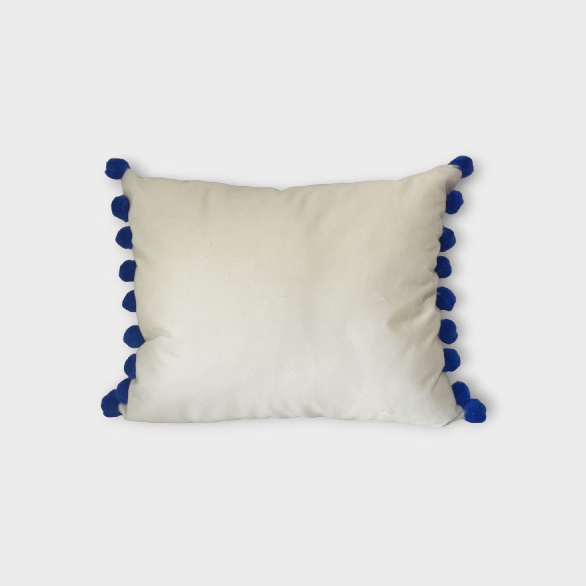 Otomi throw pillow with royal blue pompoms