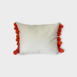 Otomi throw pillow with orange pompoms